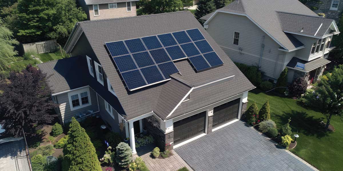 A home with solar panels installed on its roof emphasizing renewable energy.