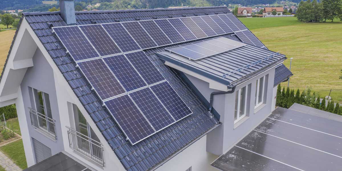 A modern residential home equipped with rooftop solar panels, representing energy efficiency and the future of solar power in BC.