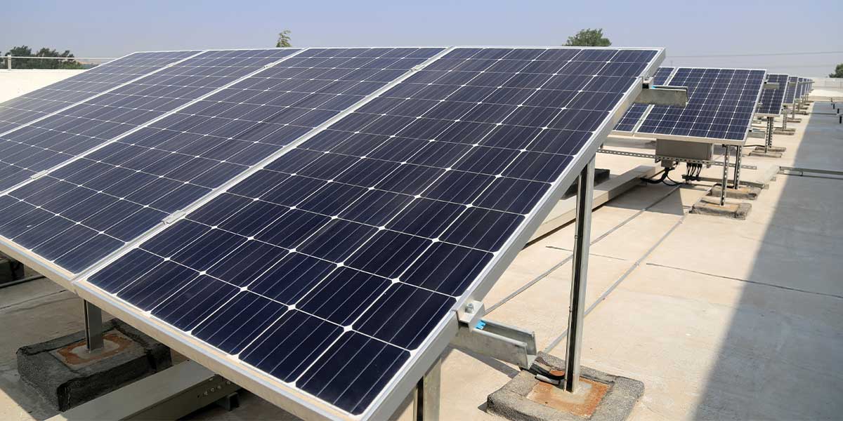 A rooftop solar panel array on a commercial building, illustrating energy efficiency and the growing role of solar technology in the future of solar power.