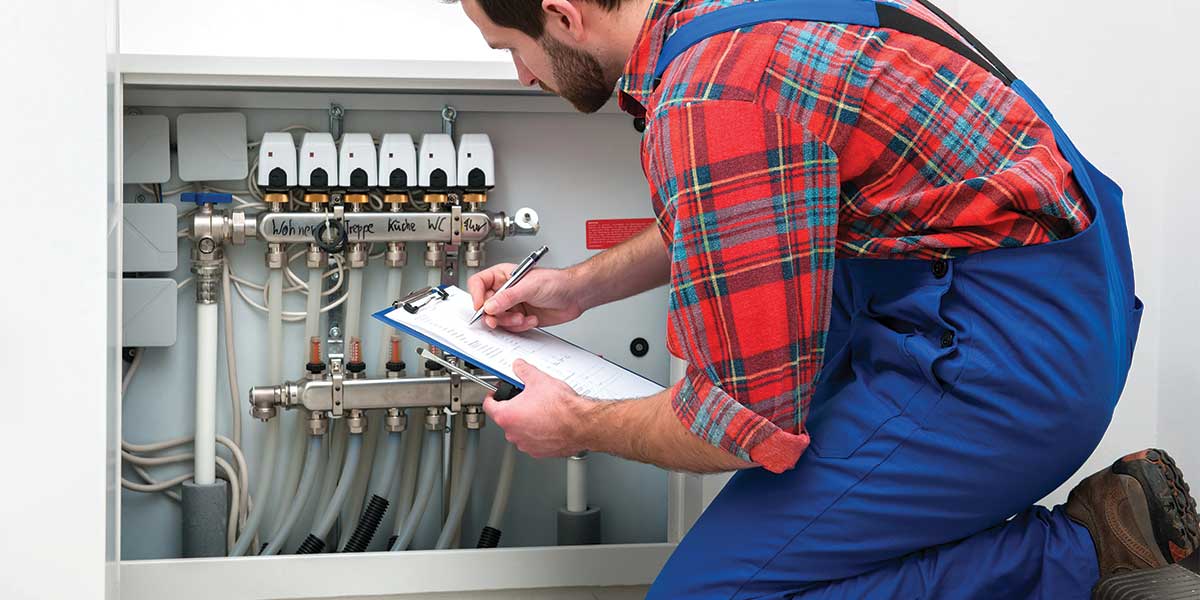 Heating System Got You Down? Expert Electric’s skilled professionals ensure your boiler and heating systems are maintained and functioning efficiently. This image highlights a technician performing routine maintenance, showcasing the expertise and attention to detail that Expert Electric provides for homes in Vancouver and the Lower Mainland. Contact Expert Electric for reliable heating system solutions.