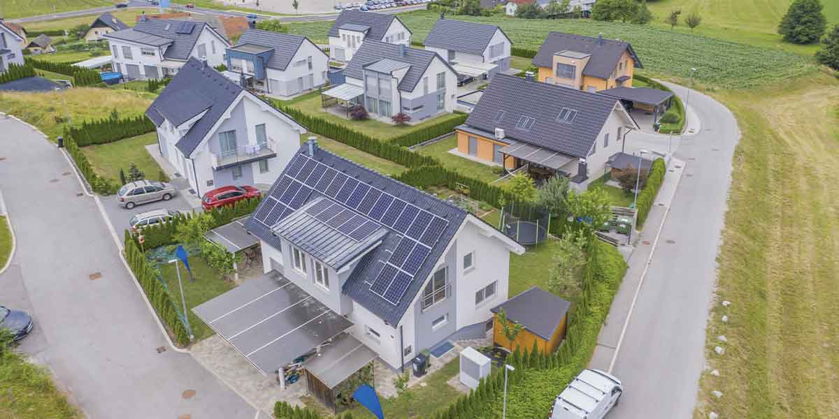 A suburban neighborhood featuring multiple homes powered by rooftop solar systems installed by Expert Electric, showcasing the benefits of unlocking the power of solar with the Canada Greener Homes Loan for energy-efficient communities.